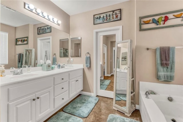 44620 Painted Desert St, Lancaster, CA 93536 - full bathroom with a bath, double vanity, a sink, and tile patterned floors