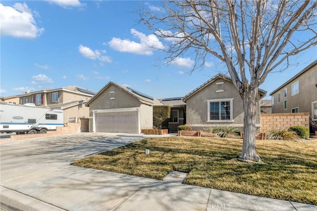 44620 Painted Desert St, Lancaster, CA 93536 - ranch-style home featuring roof mounted solar panels, an attached garage, fence, concrete driveway, and stucco siding