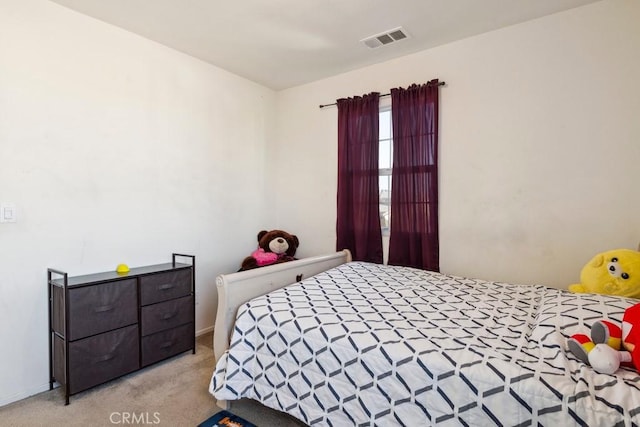 bedroom with light carpet