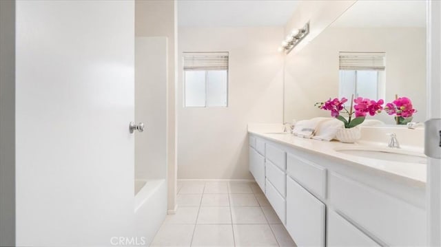 bathroom featuring vanity, tile patterned flooring, and plenty of natural light