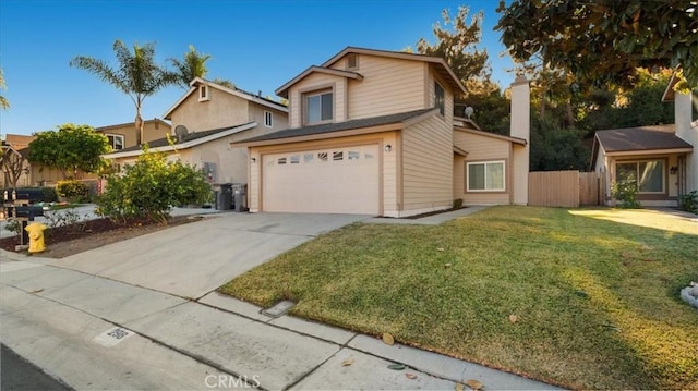 view of property featuring a front lawn and a garage