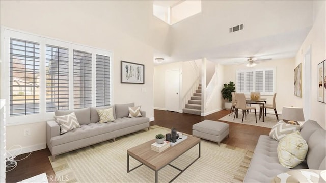 living room with ceiling fan and hardwood / wood-style flooring