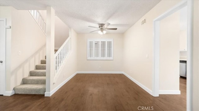 interior space with a textured ceiling, ceiling fan, and hardwood / wood-style flooring