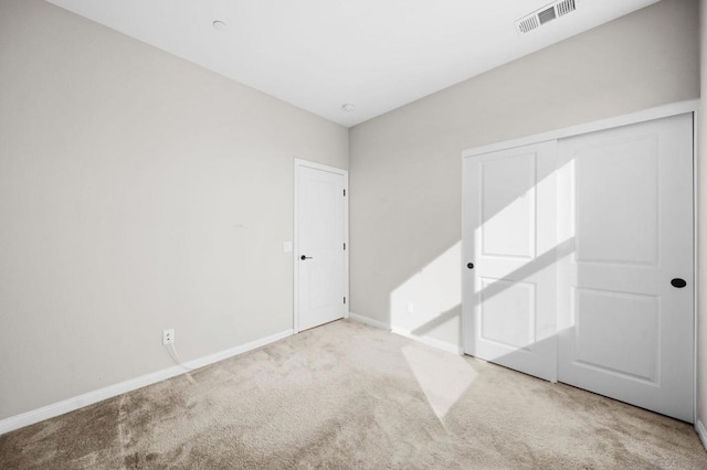 spare room with light colored carpet