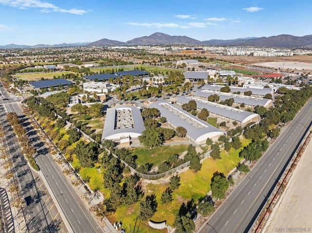 birds eye view of property with a mountain view