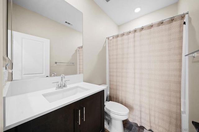 full bathroom featuring toilet, shower / tub combo, and vanity