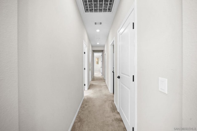 corridor with light carpet