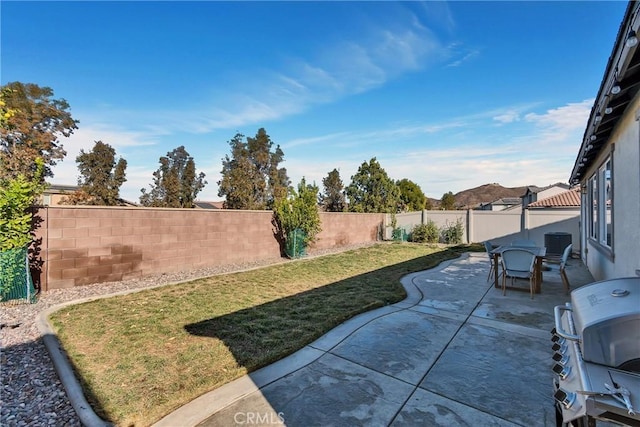 view of patio featuring cooling unit and grilling area