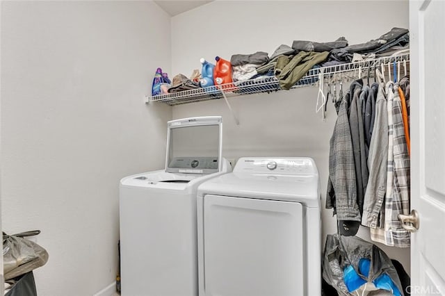 clothes washing area featuring washing machine and clothes dryer