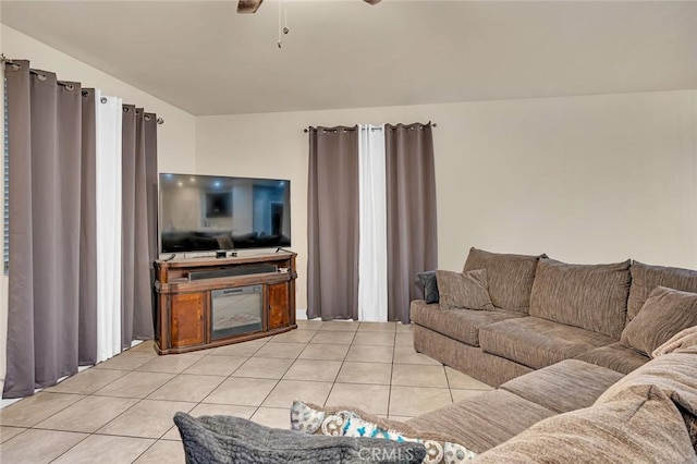 tiled living room featuring ceiling fan