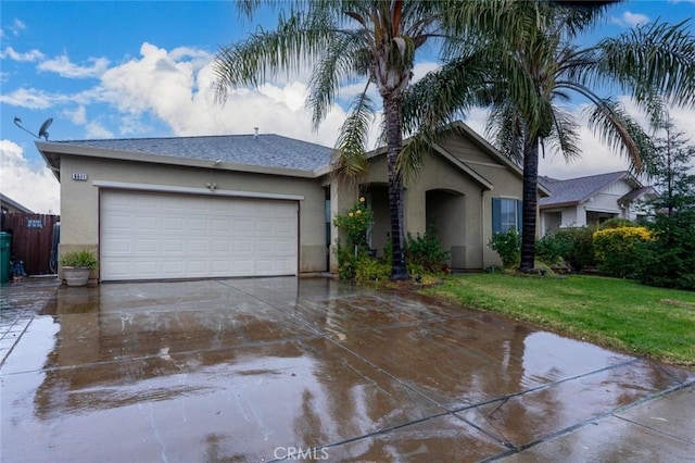 single story home featuring a front yard and a garage