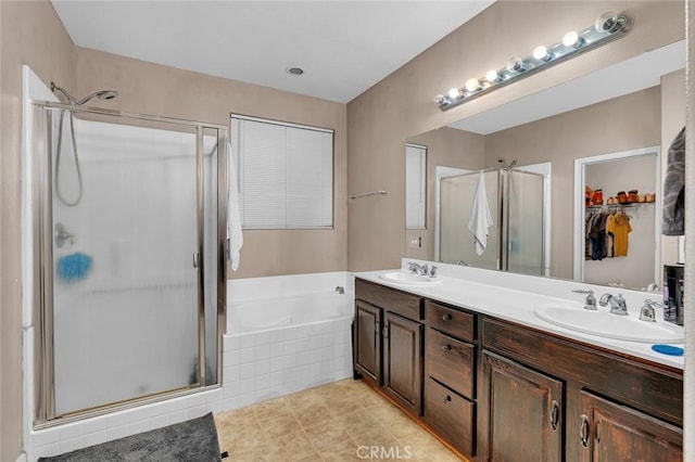 bathroom with vanity, tile patterned floors, and independent shower and bath