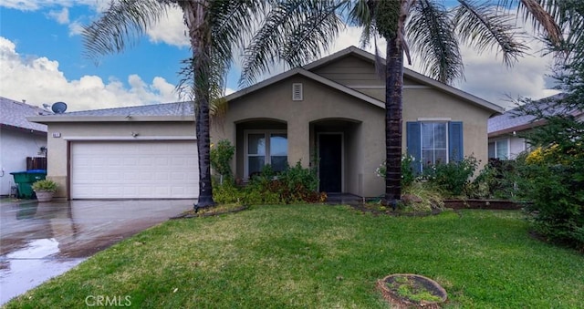 view of front of house with a front lawn and a garage