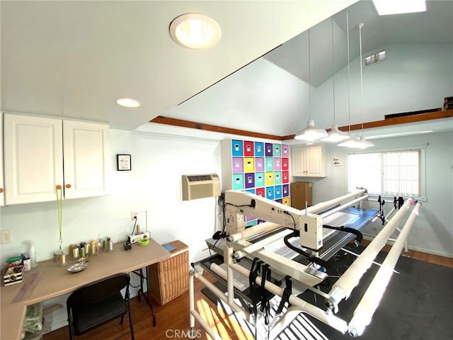 kitchen featuring an AC wall unit, white cabinetry, dark hardwood / wood-style floors, and vaulted ceiling