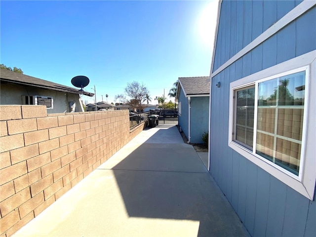 view of side of home featuring a patio