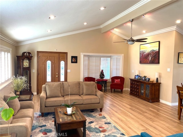 living room featuring crown molding and vaulted ceiling