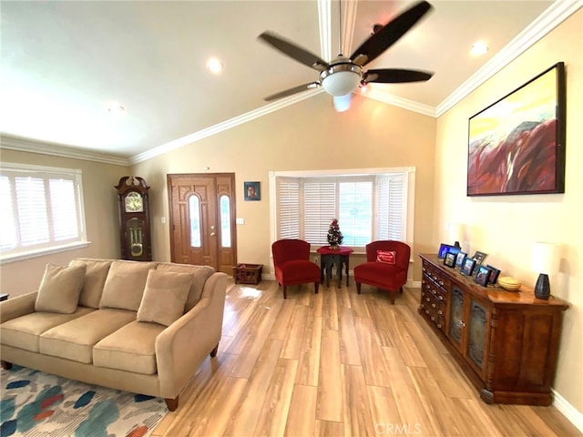 living room featuring light hardwood / wood-style floors, a wealth of natural light, crown molding, and lofted ceiling