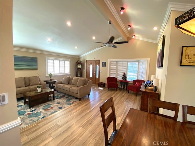 living room with ceiling fan, high vaulted ceiling, crown molding, and light hardwood / wood-style floors