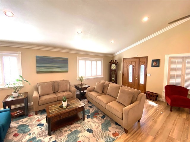 living room with light wood-type flooring, ornamental molding, and lofted ceiling