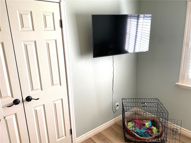 bedroom with hardwood / wood-style flooring