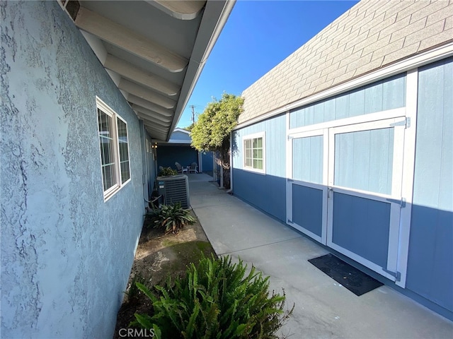 view of property exterior with central AC