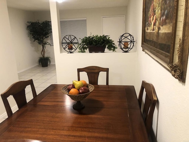 dining space with tile patterned flooring