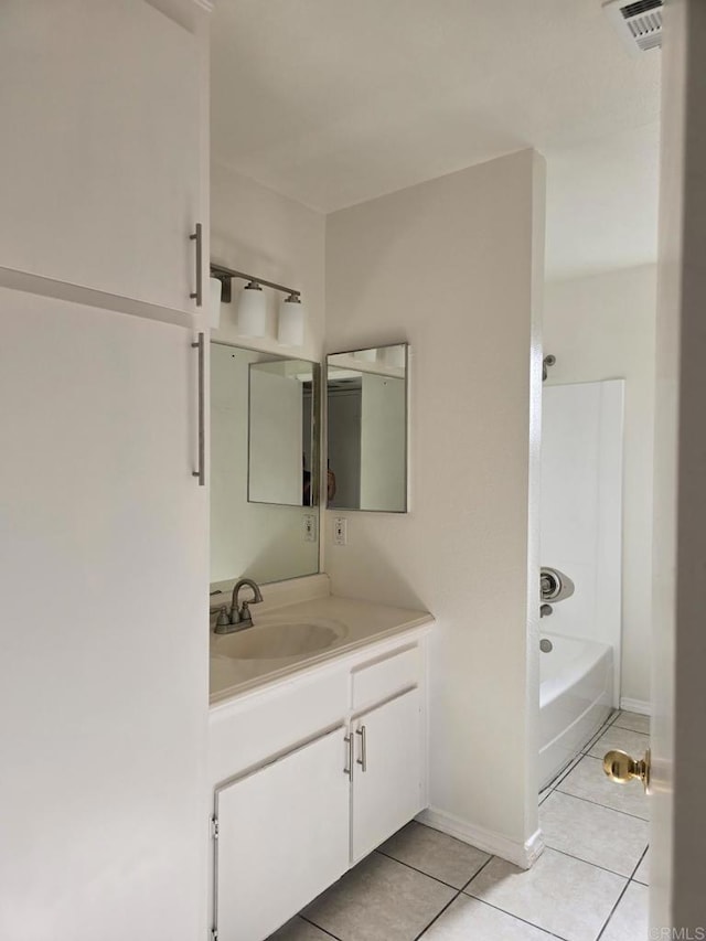 bathroom featuring bathing tub / shower combination, tile patterned floors, and vanity