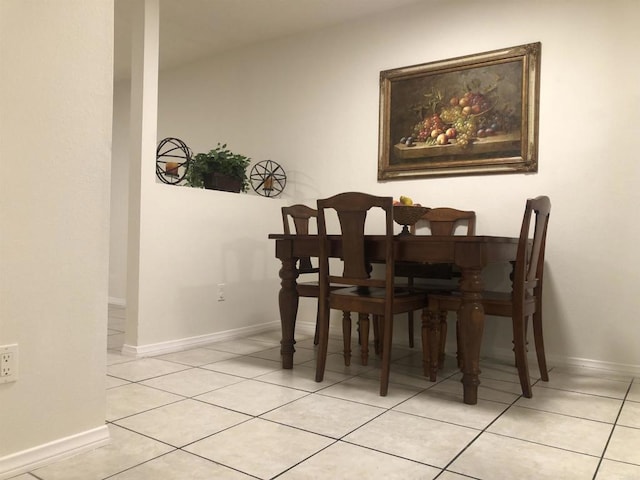 dining area with light tile patterned floors