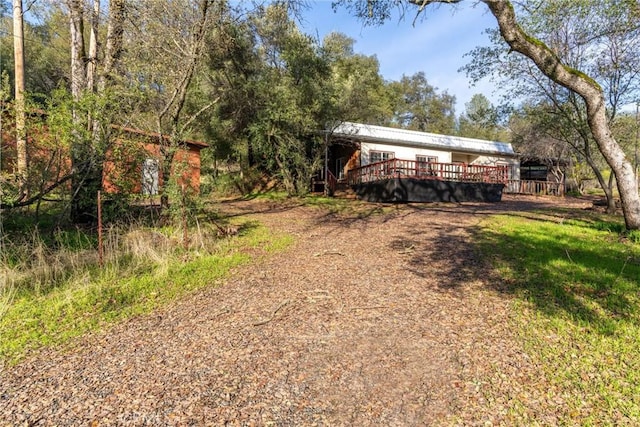 view of front of house featuring a wooden deck