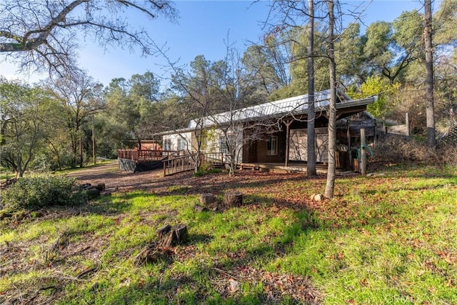 rear view of property with a deck