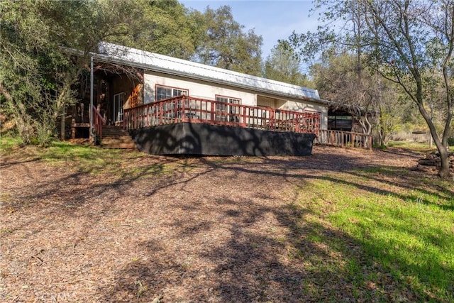 exterior space featuring a wooden deck