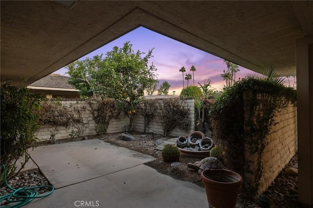 view of patio terrace at dusk