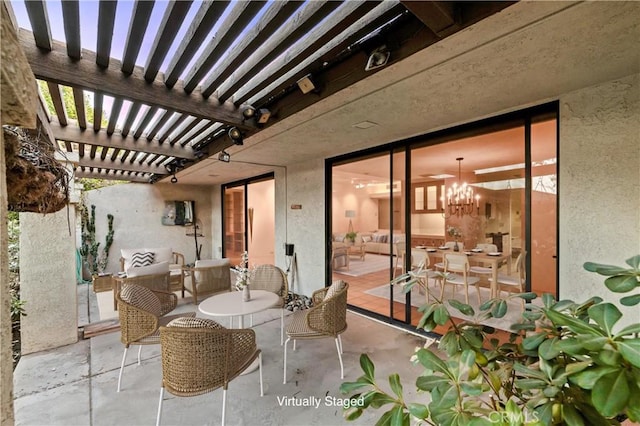 view of patio featuring an outdoor hangout area and a pergola