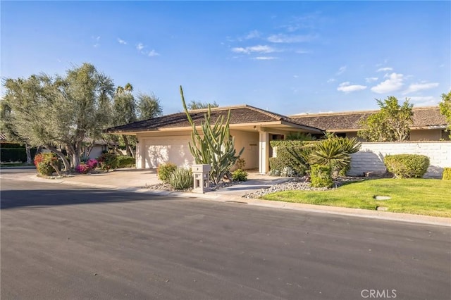 view of front of property featuring a garage