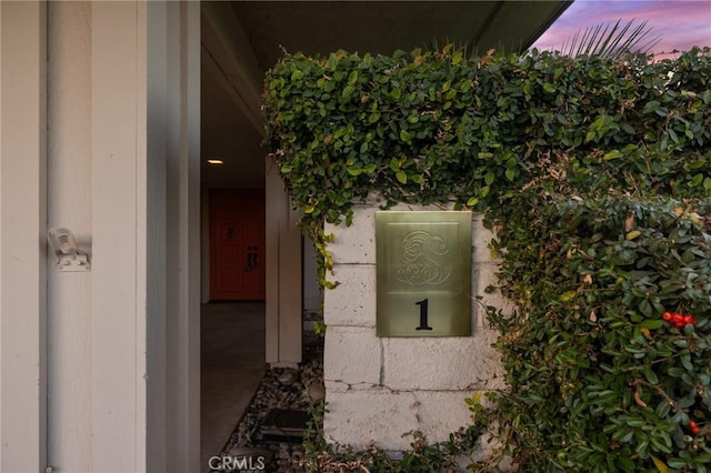 view of exterior entry at dusk