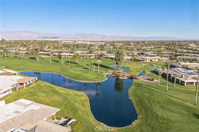 drone / aerial view featuring a water and mountain view