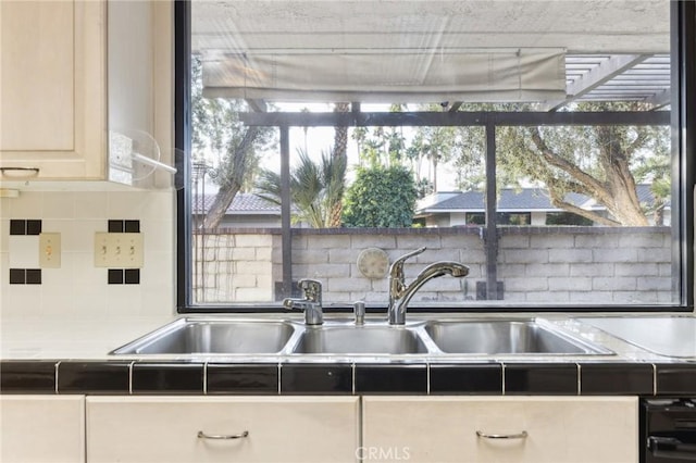 kitchen with tasteful backsplash and sink