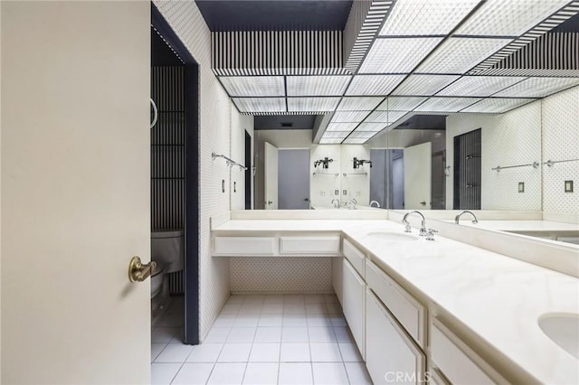 bathroom featuring tile patterned flooring and vanity