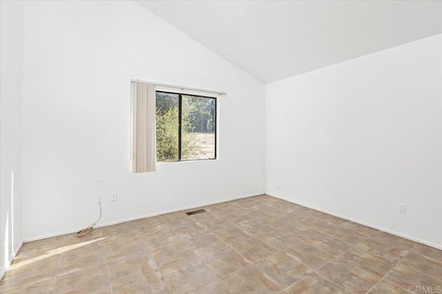 spare room with high vaulted ceiling and visible vents