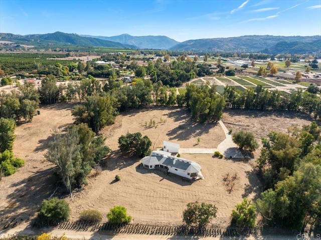 drone / aerial view featuring a rural view and a mountain view