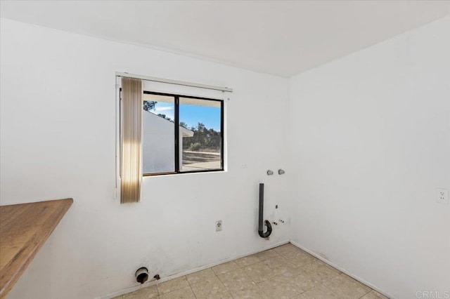 washroom with hookup for a gas dryer and laundry area