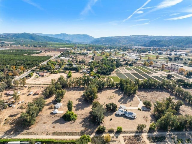 birds eye view of property with a mountain view