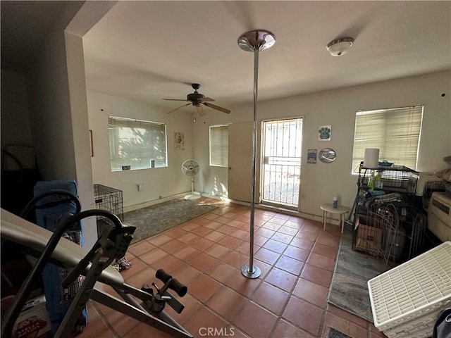 interior space featuring ceiling fan and tile patterned flooring