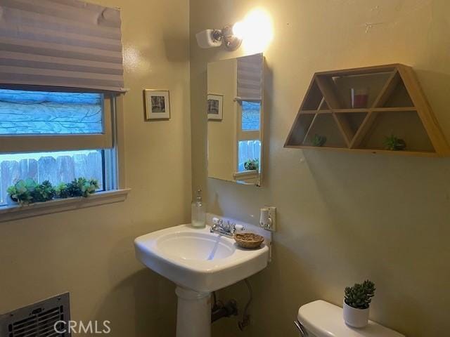 bathroom featuring toilet