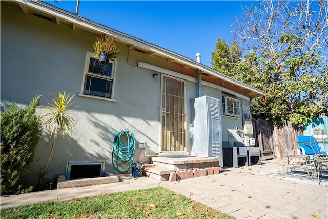 doorway to property featuring a patio