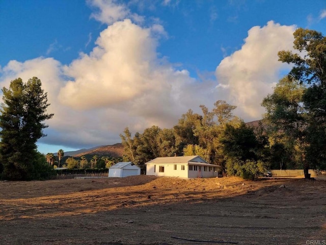 view of front facade with a mountain view and a garage