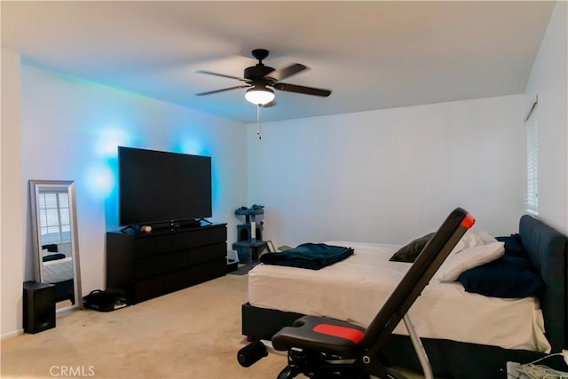 bedroom featuring ceiling fan and light colored carpet