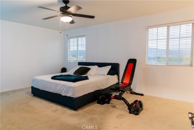 carpeted bedroom with ceiling fan