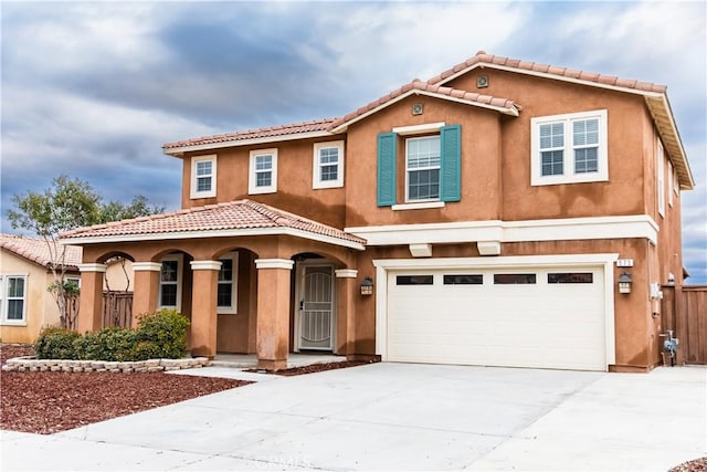 mediterranean / spanish-style house featuring a garage