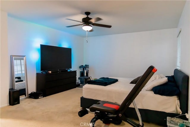 bedroom with ceiling fan and carpet flooring